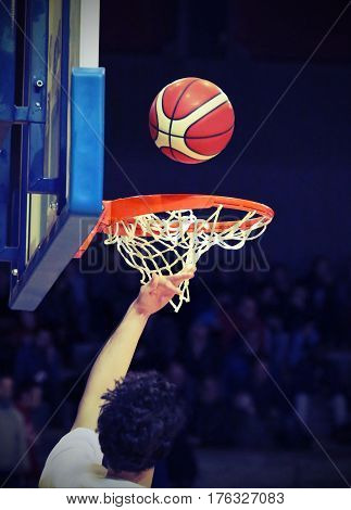 Basketball Player During The Crushing Of The Basket With The Bas
