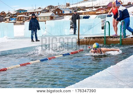 Sahyurta ,irkutsk Region, Russia - March 11.2017: Cup Of Baikal. Winter Swimming. Butterfly. Woman