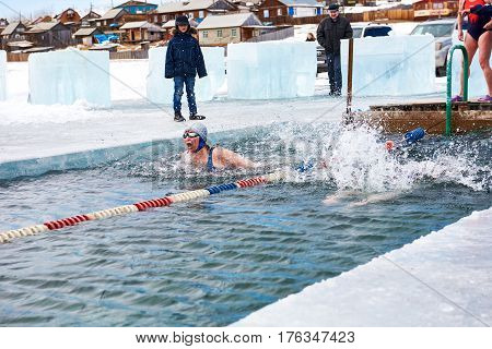 Sahyurta ,irkutsk Region, Russia - March 11.2017: Cup Of Baikal. Winter Swimming. Butterfly. Woman