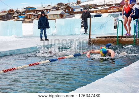 Sahyurta ,irkutsk Region, Russia - March 11.2017: Cup Of Baikal. Winter Swimming. Butterfly. Woman
