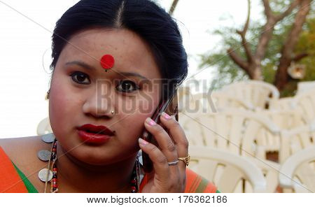 HYDERABAD,INDIA-MARCH 3:Closeup portrait of North eastern tribal woman dancer,with details of ornaments and dress in Shilparamam on March 3,2017 in Hyderabad,India