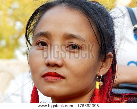 HYDERABAD,INDIA-MARCH 3:Closeup portrait of North eastern tribal woman dancer,with details of ornaments and dress in Shilparamam on March 3,2017 in Hyderabad,India