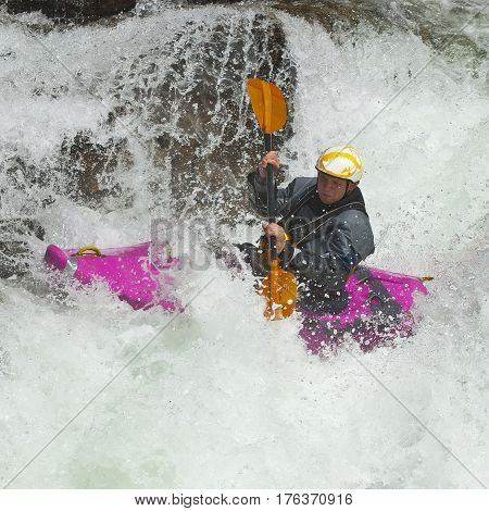 Kayaker in the waterfall in Norway Ula river