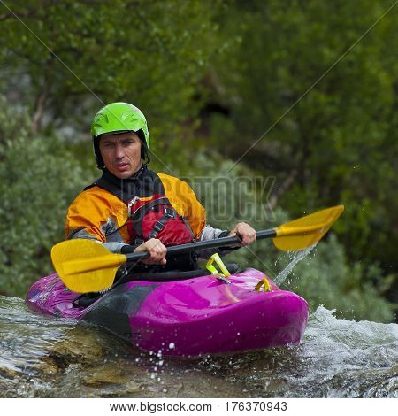 Kayaker in the waterfall in Norway Ula river
