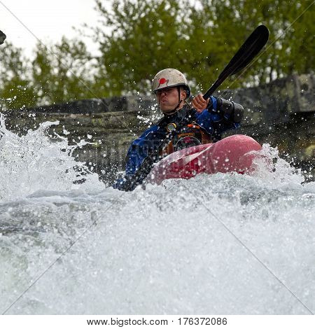 Kayaker in the waterfall in Norway Ula river