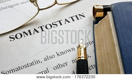 Somatostatin written on a page. Human hormones.
