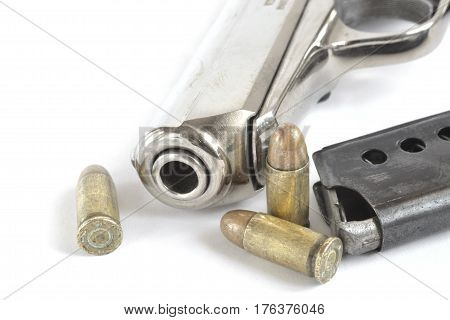 Pistol and ammunition on the white background.
