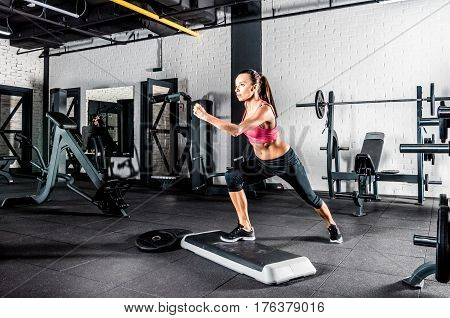 Woman Exercising In Gym