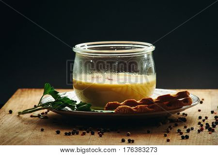 cream soup with cut sausage in the bowl. Top view