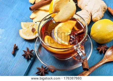 Cup Of Ginger Tea With Lemon And Honey On Dark Blue Background,