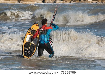 SAN BENEDETTO DEL TRONTO, ITALY - MARCH 10, 2017: Portrait of kitesurfer on adriatic sea