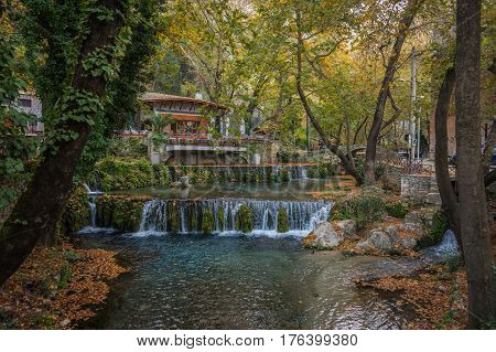 Autumn landscape with a river and small house, Livadia, Greece