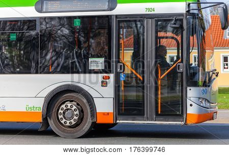 HANNOVER / GERMANY - MARCH 12 2017: regular bus from UESTRA drives on route to the next stop. UESTRA is the operator of public transport in the city of Hanover Germany