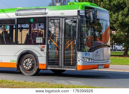 HANNOVER / GERMANY - MARCH 12 2017: regular bus from UESTRA drives on route to the next stop. UESTRA is the operator of public transport in the city of Hanover Germany