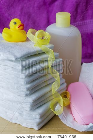 accessories for baby diapers on white background, banny, a bottle of water, cream