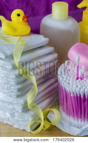 accessories for baby diapers on white background, banny, a bottle of water, cream