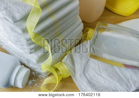 accessories for baby diapers on white background, banny, a bottle of water, cream