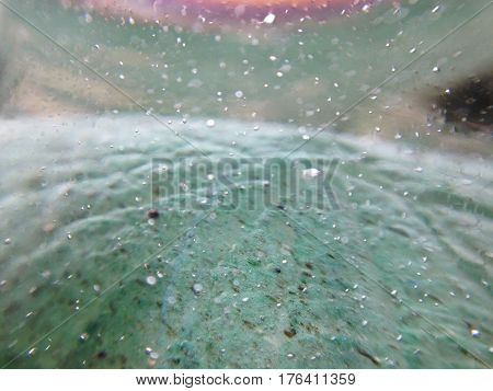 The depth of the glass statue. Green blurred background.
