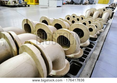 St. Petersburg Russia - February 13 2010: The Armalit factory produces ship armature for shipbuilding companies. Connecting pipes after machining on the production line.