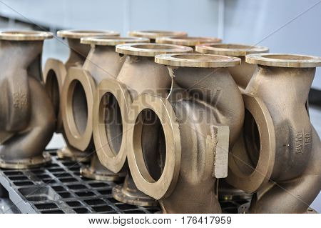 St. Petersburg Russia - February 13 2010: The Armalit factory produces ship armature for shipbuilding companies. Connecting pipes after machining on the production line.