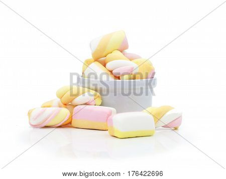 Pastel Marshmallows in white cup on white background
