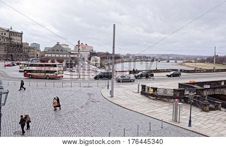 Dresden Germany- January 42017:The bridge of Augustus built in the XIII century and restored by the order of Augustus the Strong. Pedestrians and vehicles are moving along the bridge