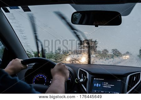 Driving The Car On The Road On A Rainy Day