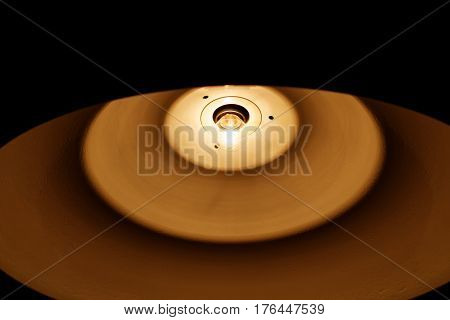 The electric light above the pool table.
