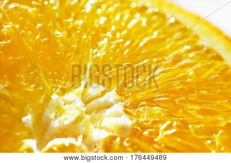 Slice of cut fresh ripe orange fruit macro close up photo. Orange background