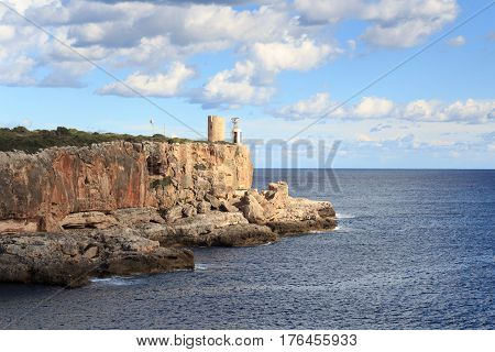 Watchtower Torre d'en Beu and Mediterranean Sea in Cala Figuera Majorca Spain