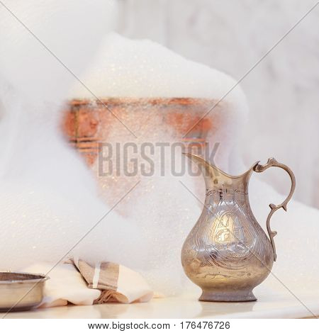 Making Soap Foam For Massage. Water Jar, Towel And Copper Bowl With Soap Foam In Turkish Hamam. Trad