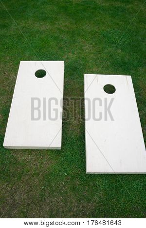 Vertical Wooden Cornhole Boards from Above on Grass