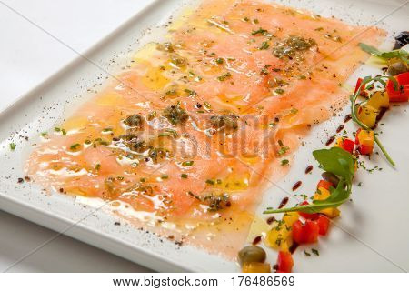 Salmon Carpaccio On A White Plate. Seafood Carpaccio - Salmon Carpaccio