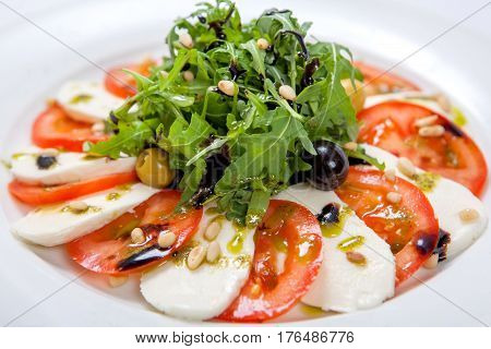 Caprese Salad. Fresh Salad With Fresh Juicy Tomatoes With Mozzarella Cheese And Fresh Arugula
