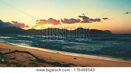 Panoramic view from the coast of Aspra (Sicily) with colofrul sky and mountains on background at the sunset.