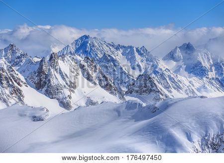 Alps, view from Mt. Titlis in Switzerland in winter. Titlis is a mountain, located on the border between the Swiss cantons of Obwalden and Bern.