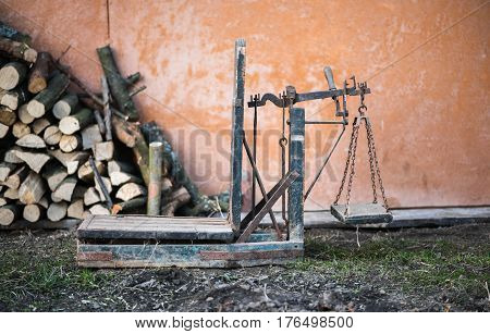 Ancient platform scales wood and iron weighing machine. Ukraine