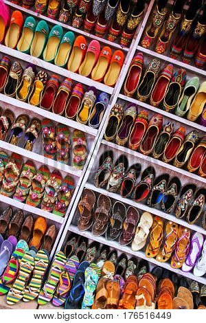 Display of shoes at the street market in Taj Ganj neighborhood of Agra Uttar Pradesh India. Agra is one of the most populous cities in Uttar Pradesh