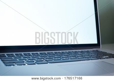 Laptop keyboard close up with white copy space screen . seleted focus.
