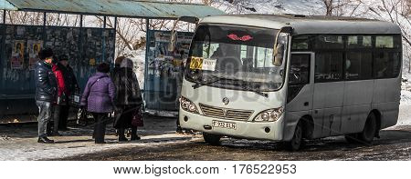 Kazakhstan, Ust-Kamenogorsk, march 7, 2017: Bus stop, people at the bus stop, public transport, bus arrival