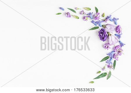 Flowers composition. Frame made of various colorful flowers on white background. Flat lay top view