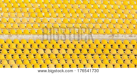 yellow seats on the podium . Professional photo