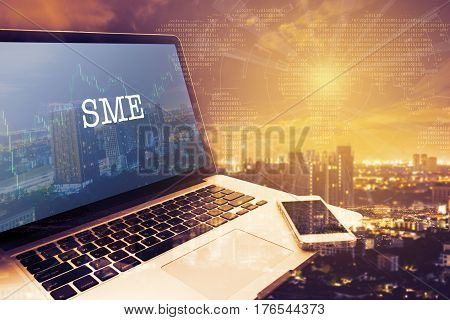 SMEs (SMALL AND MEDIUM-SIZED ENTERPRISES): Grey screen laptop computer. Vintage effects. Digital Business and Technology Concept.