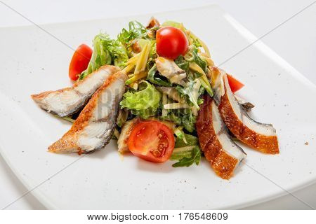 Salad Lettuce With Pieces Of Grilled Fish, Tomatoes And Grated Cheese