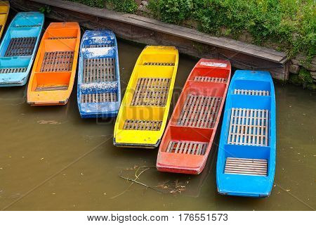 Colorful punts on the river Cherwel. Oxford Oxfordshire England UK