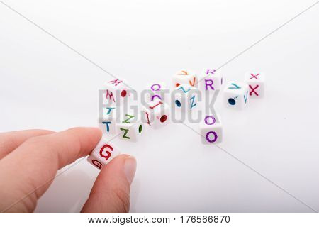 Colorful Alphabet Letter Cubes In Hand