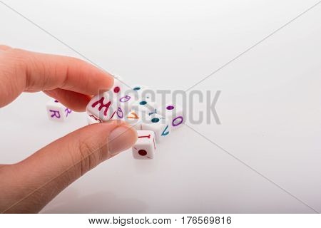 Colorful Alphabet Letter Cubes In Hand