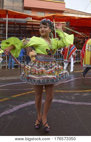 ORURO, BOLIVIA - FEBRUARY 25, 2017: Traditional Bolivian dancer in colourful costume parading through the mining city of Oruro on the Altiplano of Bolivia during the annual Oruro Carnival.