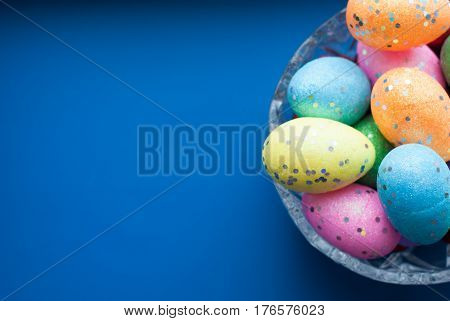 Easter Eggs In A Crystal Dish On A Blue Background,