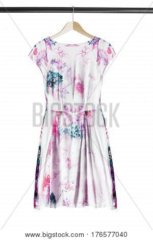 elegant silk dress on wooden clothes rack isolated over white
